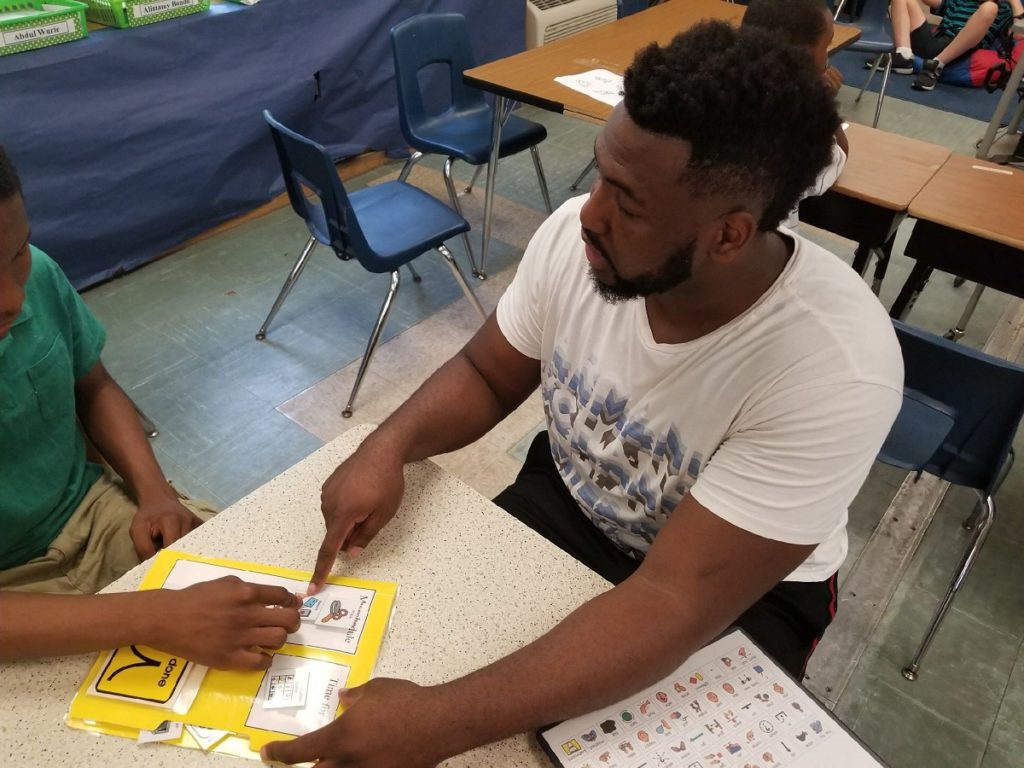 Paraprofessional Mr. Cliff Jones with his Students