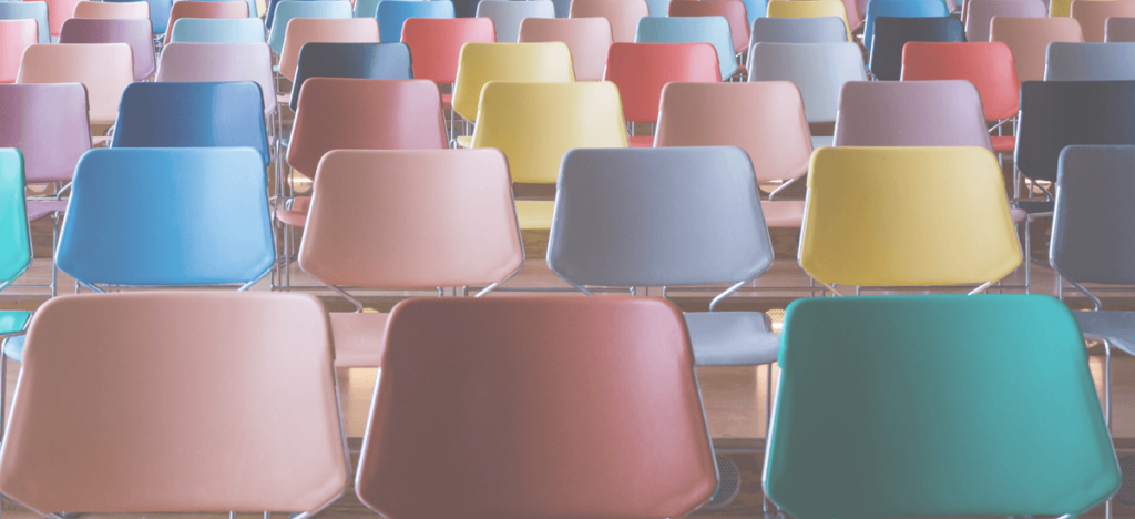 Colorful school chairs in rows