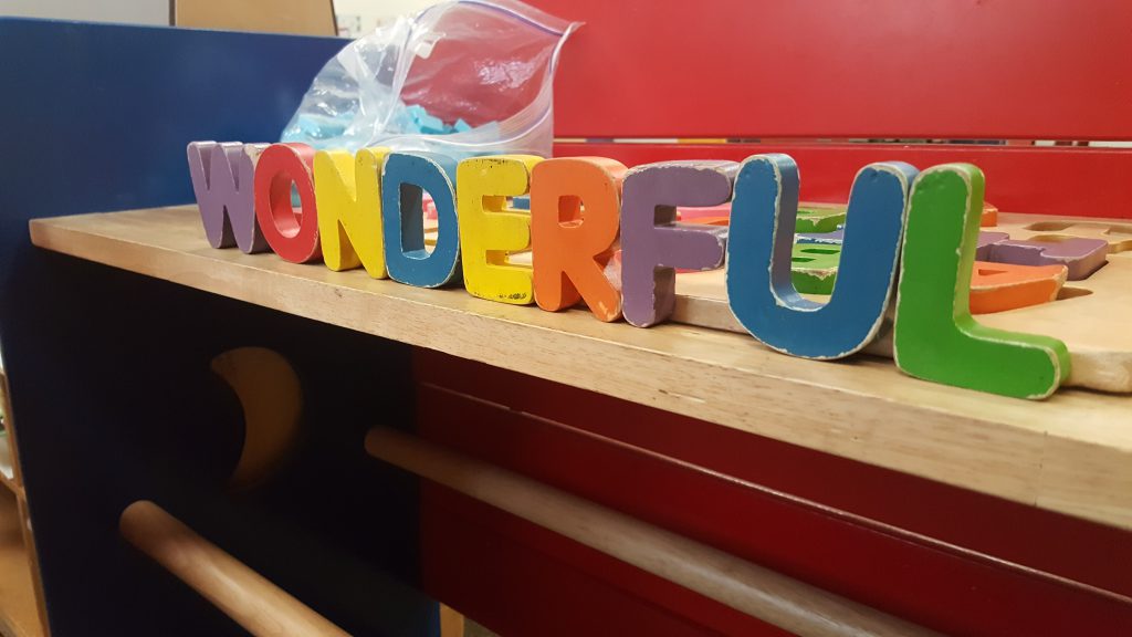 Colorful toys spelling wonderful