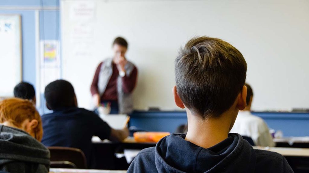 Back view of children in a classroom