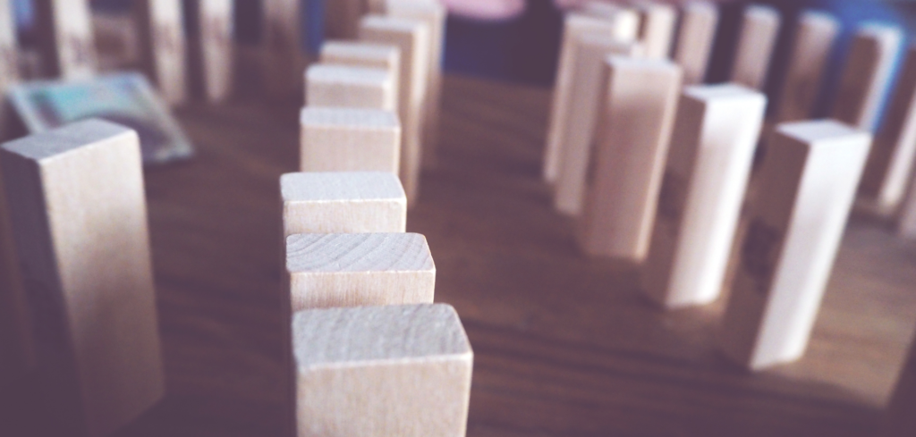 Wooden dominos stacked on a table