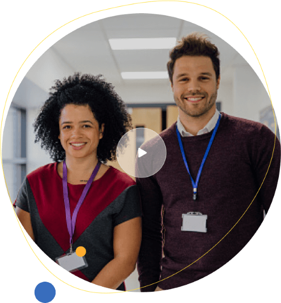 Male and female teachers wearing ID badges smiling