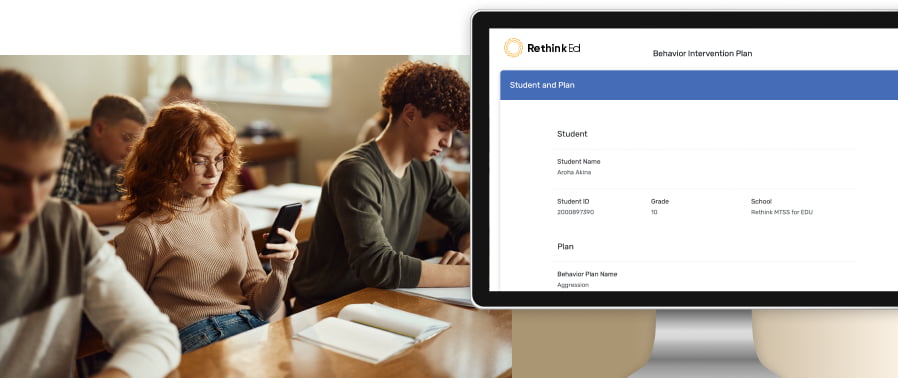 Female redhead using RethinkEd Behavior Suite app during a class