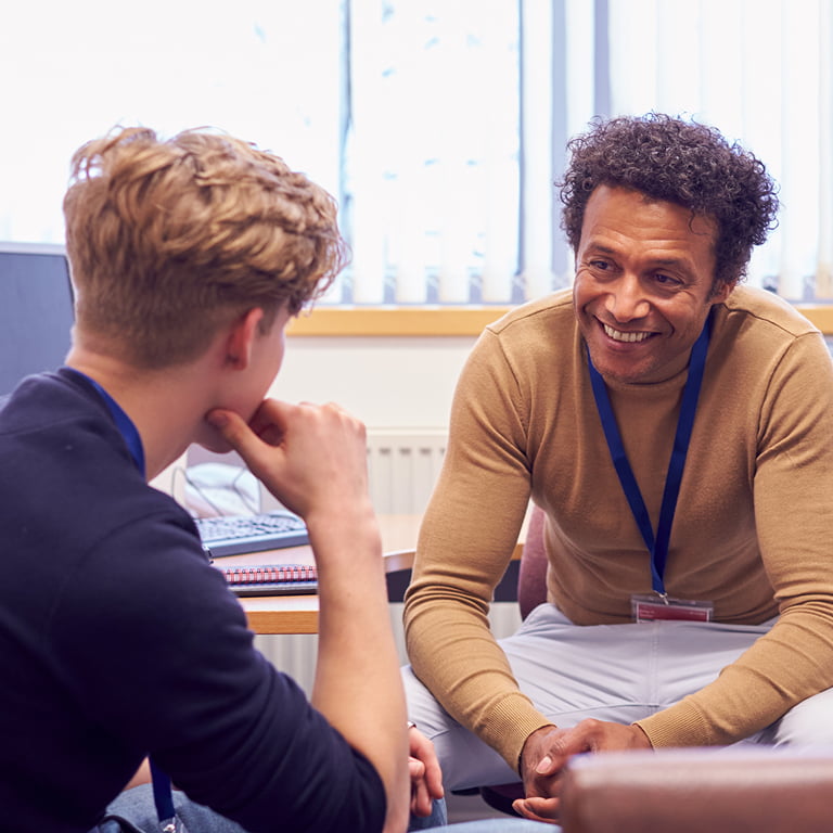 Male college student and campus Counselor discussing mental health issues