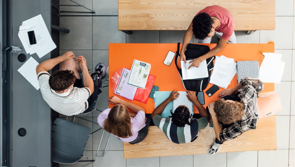 aerial shot of secondary school students together in common room